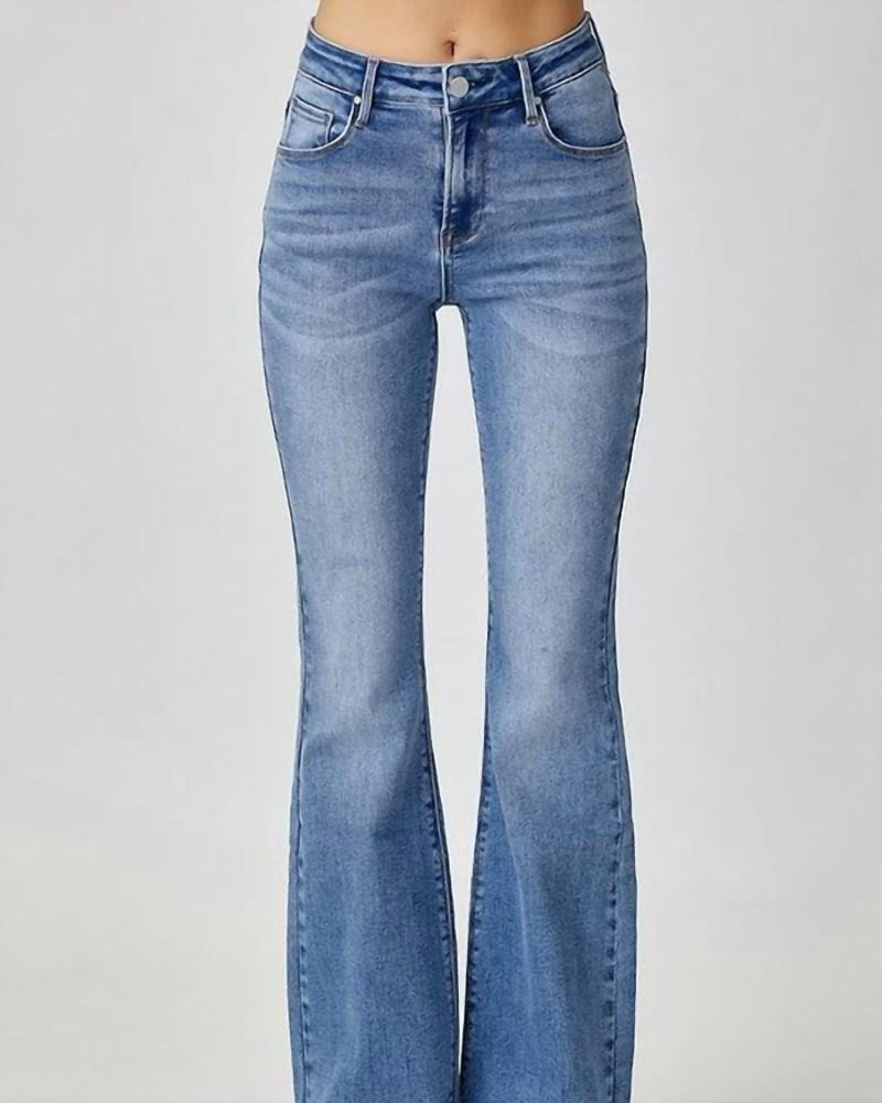 Front of a model wearing a size 2X Mid Rise Basic Flare Jean in Medium Wash in Medium Wash by RISEN. | dia_product_style_image_id:326474